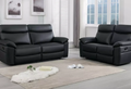 Modern black leather reclining sofa and loveseat set.