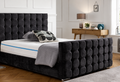 Modern black upholstered cubed bed frame in bedroom