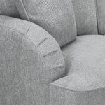 Gray fabric sofa with a focus on texture and stitching detail.