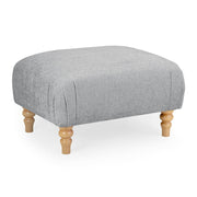 Gray upholstered ottoman with wooden legs 