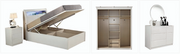 Furniture set including a bed with storage, wardrobe, and dresser on a white background